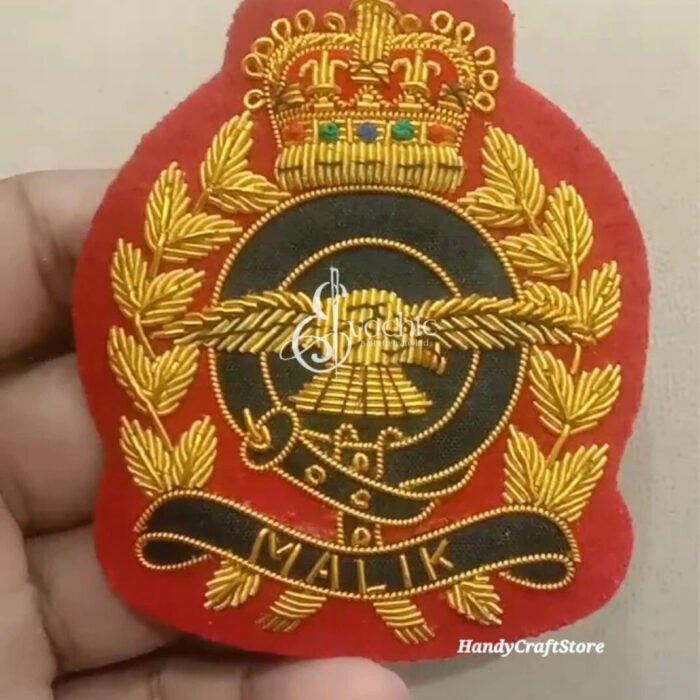 Handmade gold bullion embroidered crest badge featuring a crown, eagle, and custom name banner.