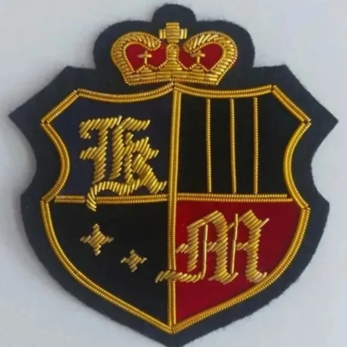 Handmade gold bullion embroidered crown and shield crest badge for blazers.